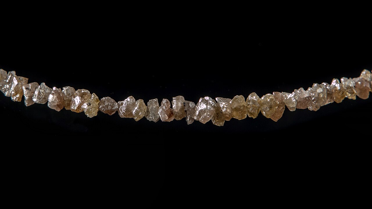 Diamond jewelry on display at a red carpet event.