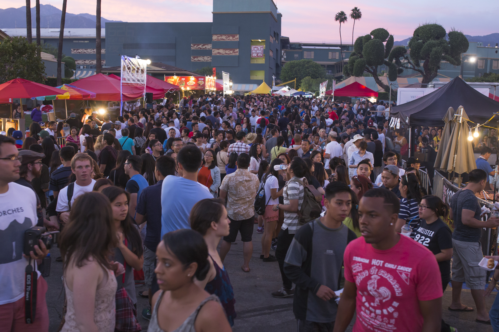 Crowd at 626 Night Market among food and merchandise booths.