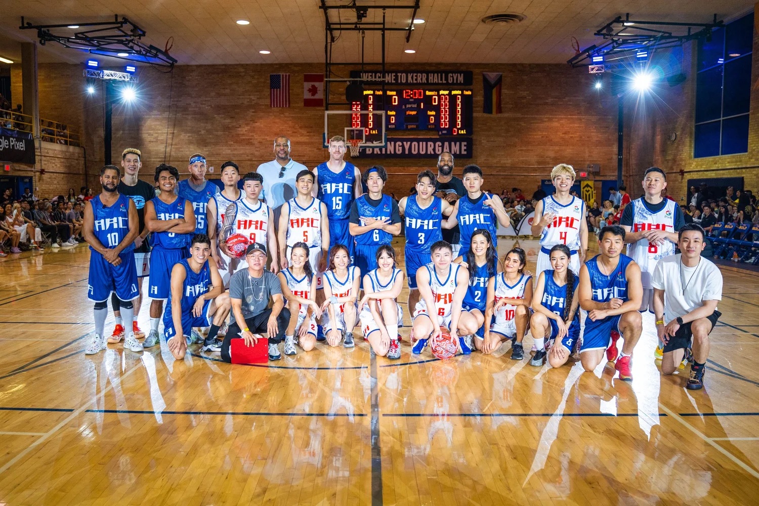 Celebrity basketball players and creators pose on court at ARC Hoops during ARC WORLD.