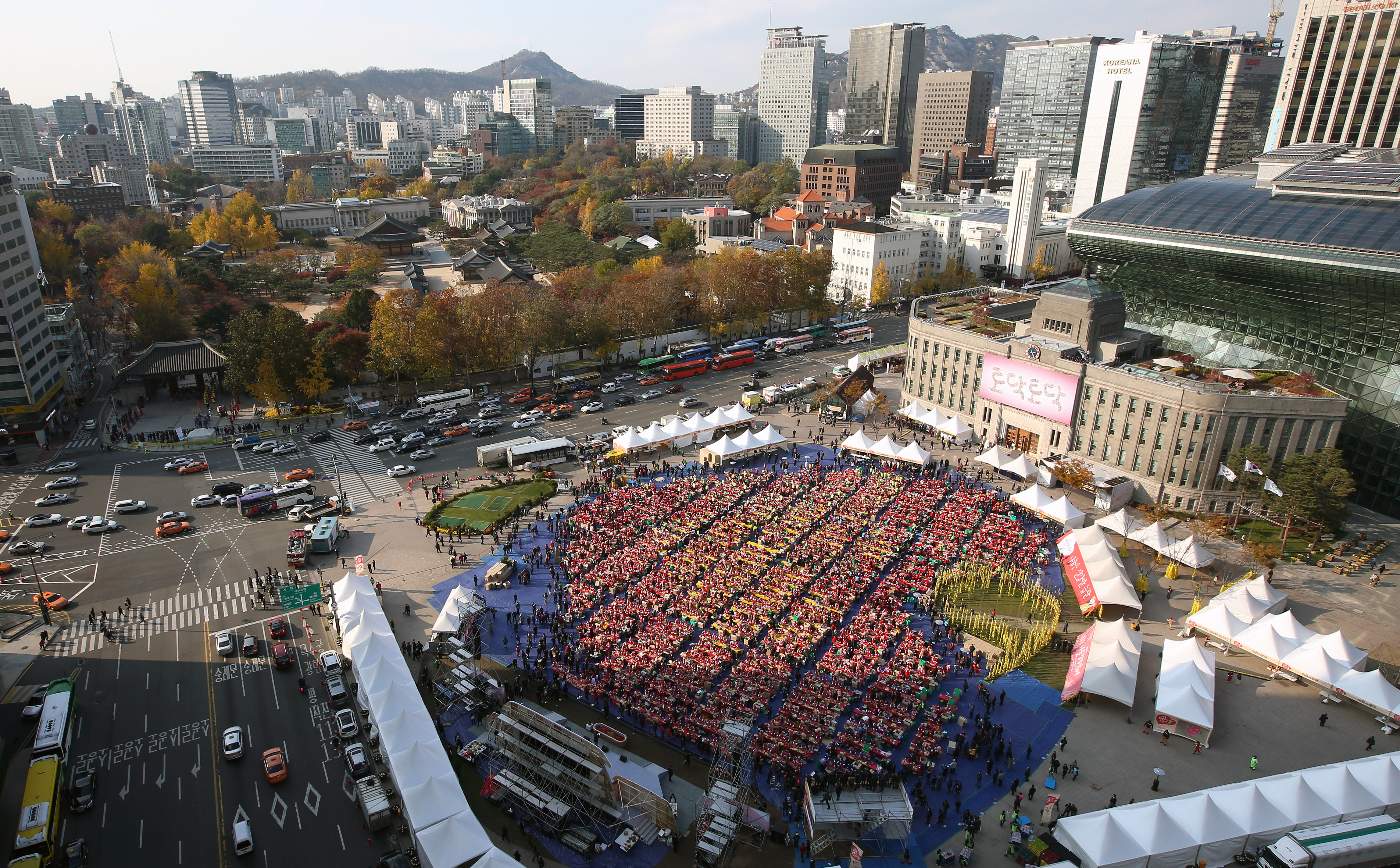 Asian food festival vendors and crowd energy at an outdoor market.