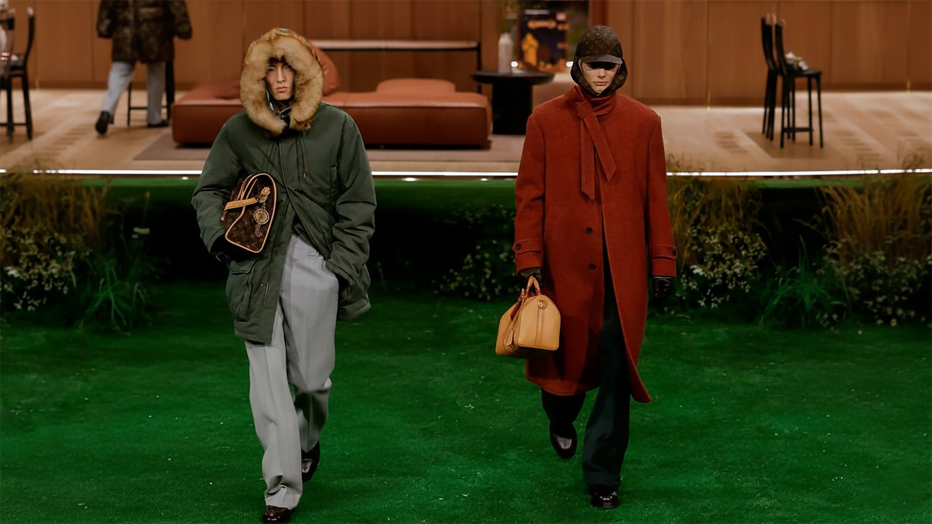 Kazakh models Erik Ilin and Alzhan Zhandarbekov walking Louis Vuitton men's fall-winter 2026 on the grass runway in Paris.