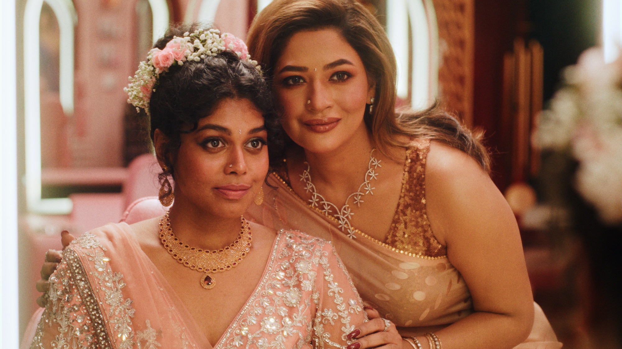 Two women in ornate South Asian formal wear in a mirrored salon, from Rubaiyat Hossain's The Difficult Bride.