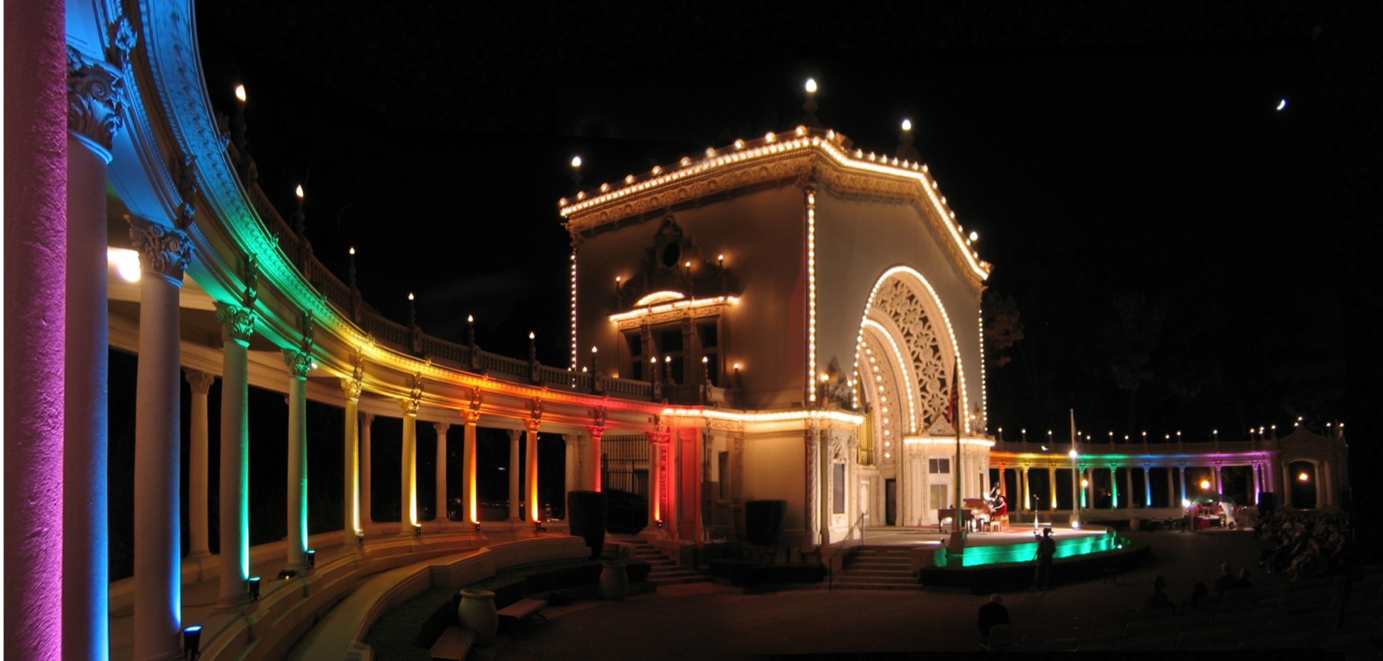 Spreckels Organ Pavilion in Balboa Park lit for a nighttime summer festival concert.
