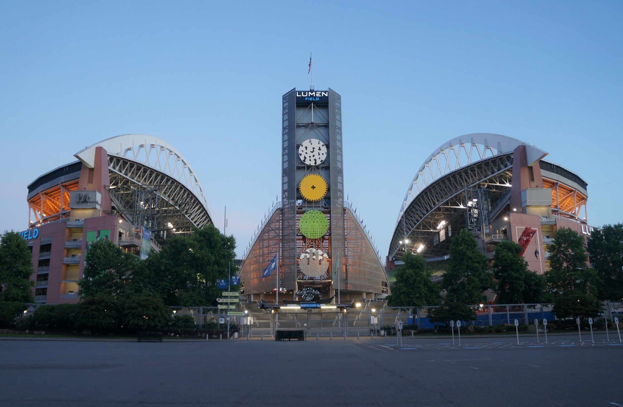 The north side of Lumen Field at dusk, where Filipino Heritage Night programming is listed in the North Plaza.