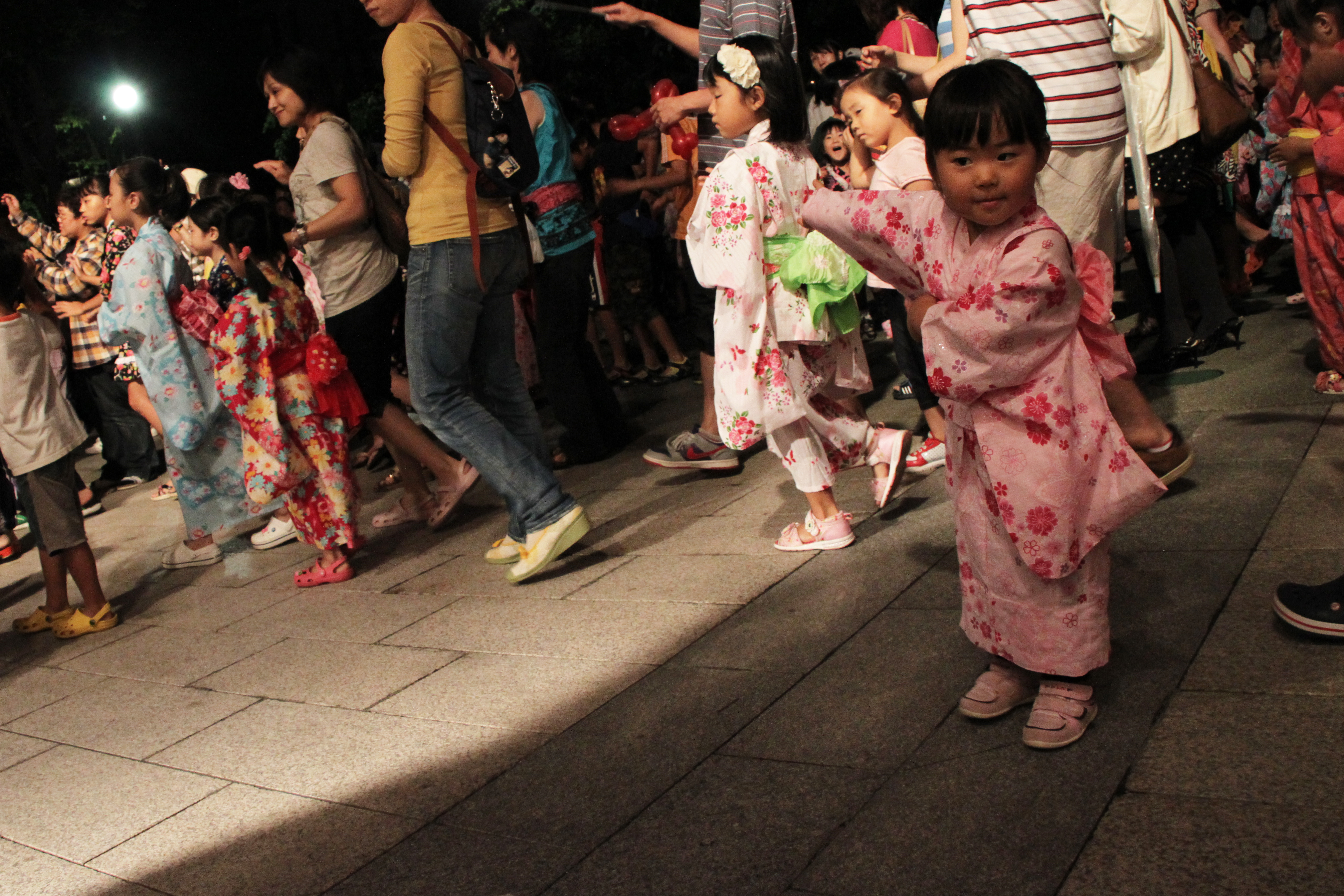 Bon Festival dancers in yukata at a summer Obon celebration.