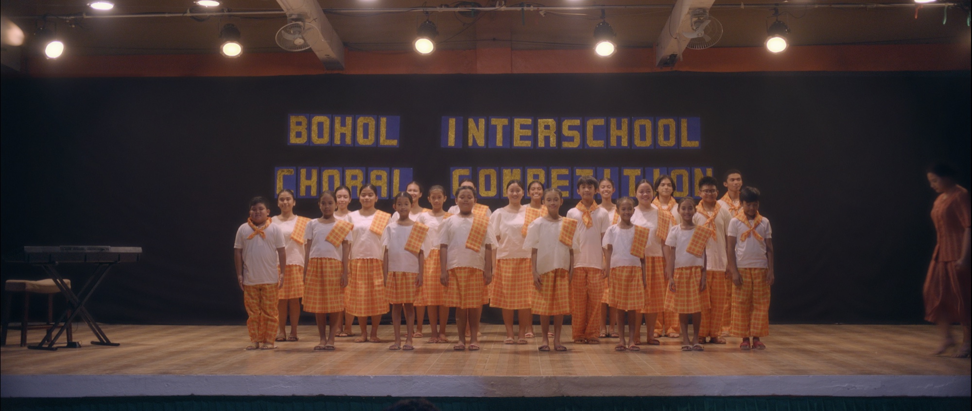 The Loboc Children’s Choir stands onstage in Song of the Fireflies, the ASEAN Film Festival 2026 opening film.