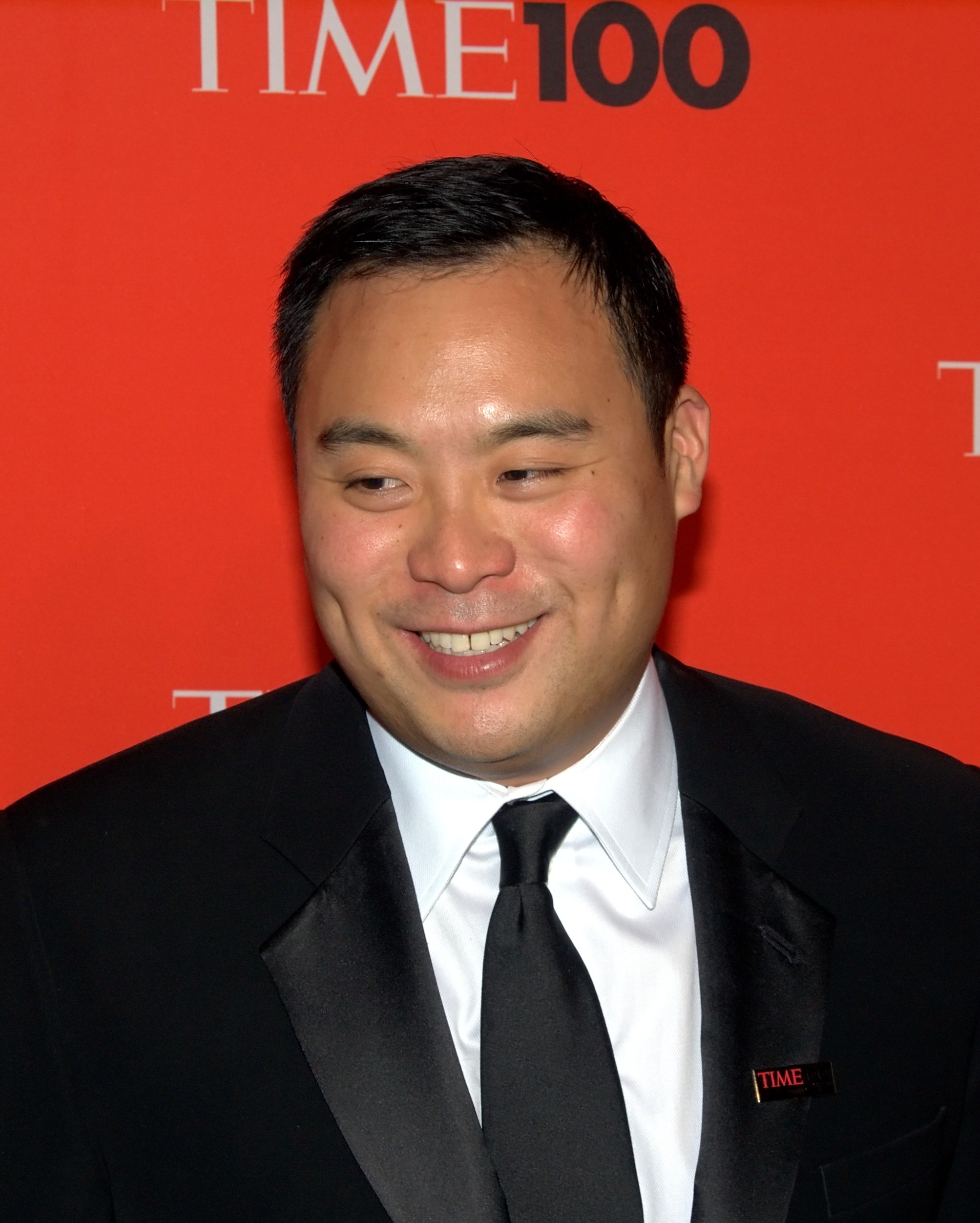 Korean American chef David Chang in a black jacket, looking toward camera in a 2010 portrait.