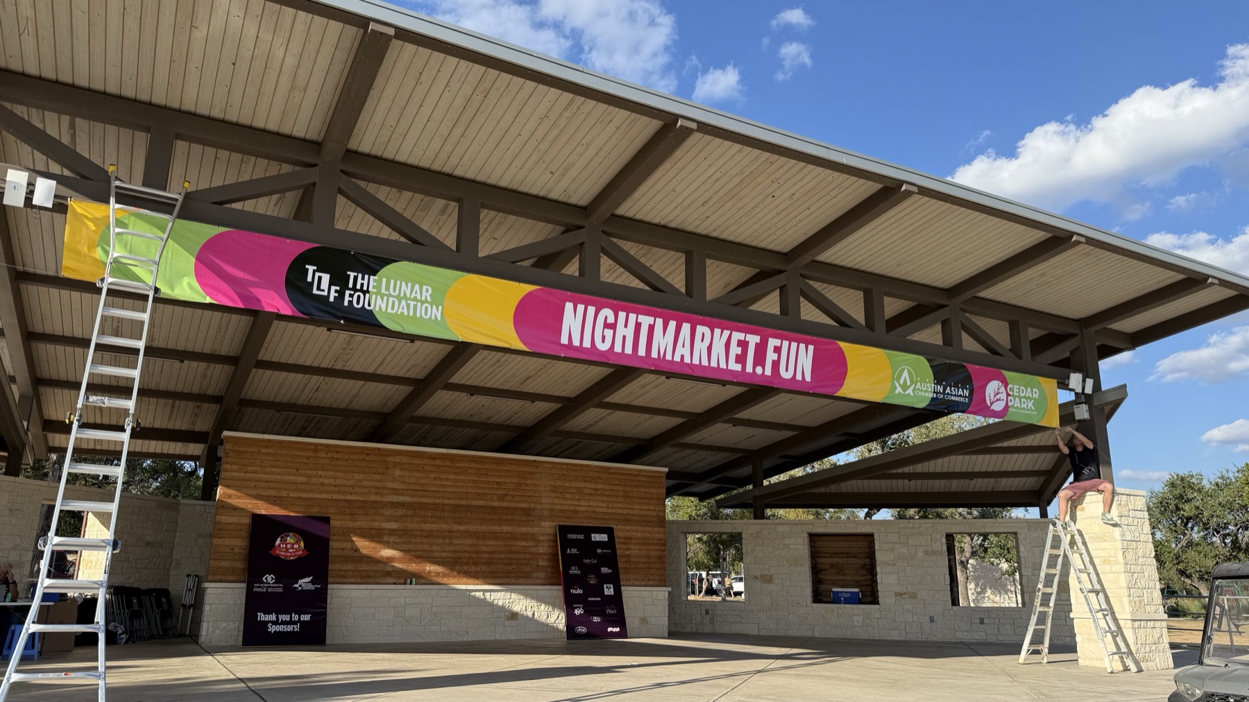 NightMarket.fun Asian pop culture festival promotional scene with vendors and crowd energy.