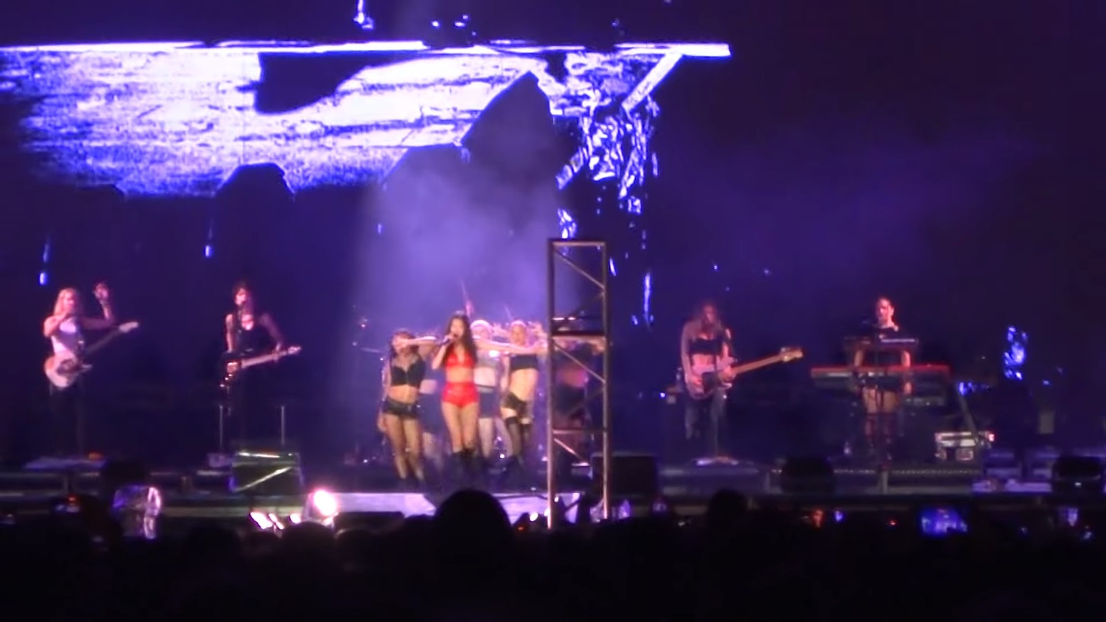 Olivia Rodrigo performing on stage at Lollapalooza Argentina in 2025.