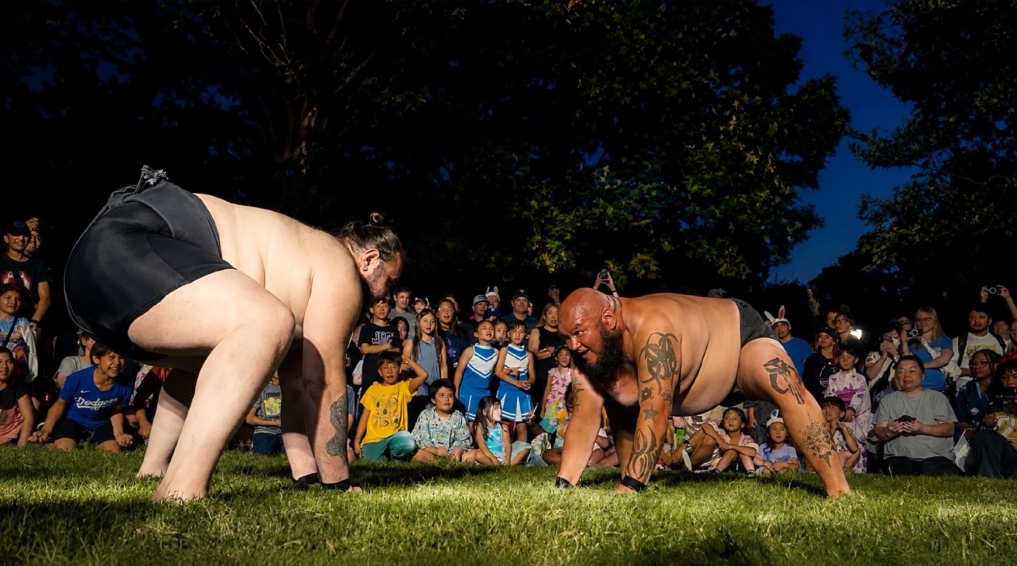 Sumo demonstration imagery promoting Otsukimi Japanese Moon Viewing Festival in Plano.