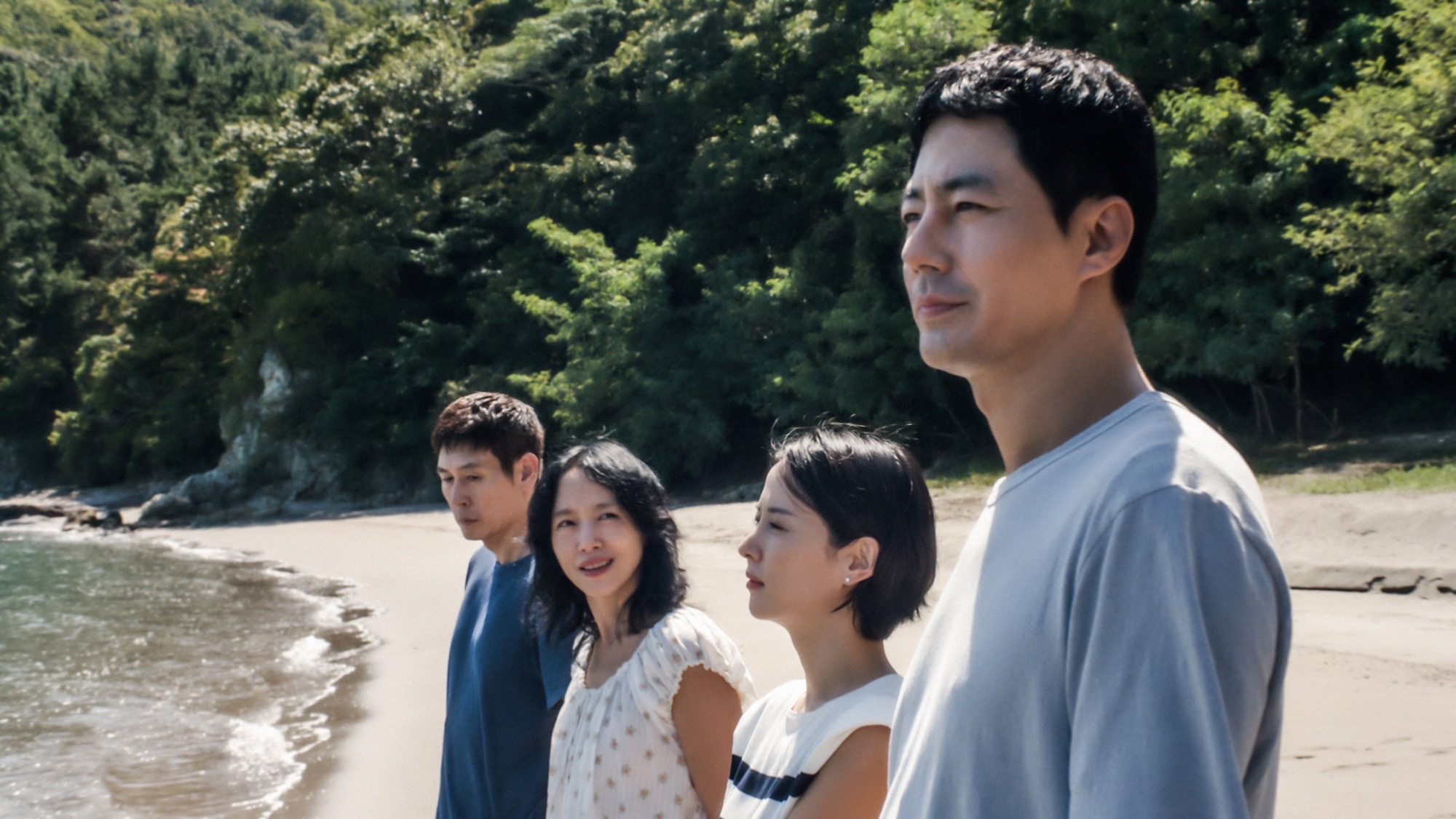Sul Kyung-gu, Jeon Do-yeon, Cho Yeo-jeong, and Zo In-sung stand on a beach in Lee Chang-dong's Possible Love.