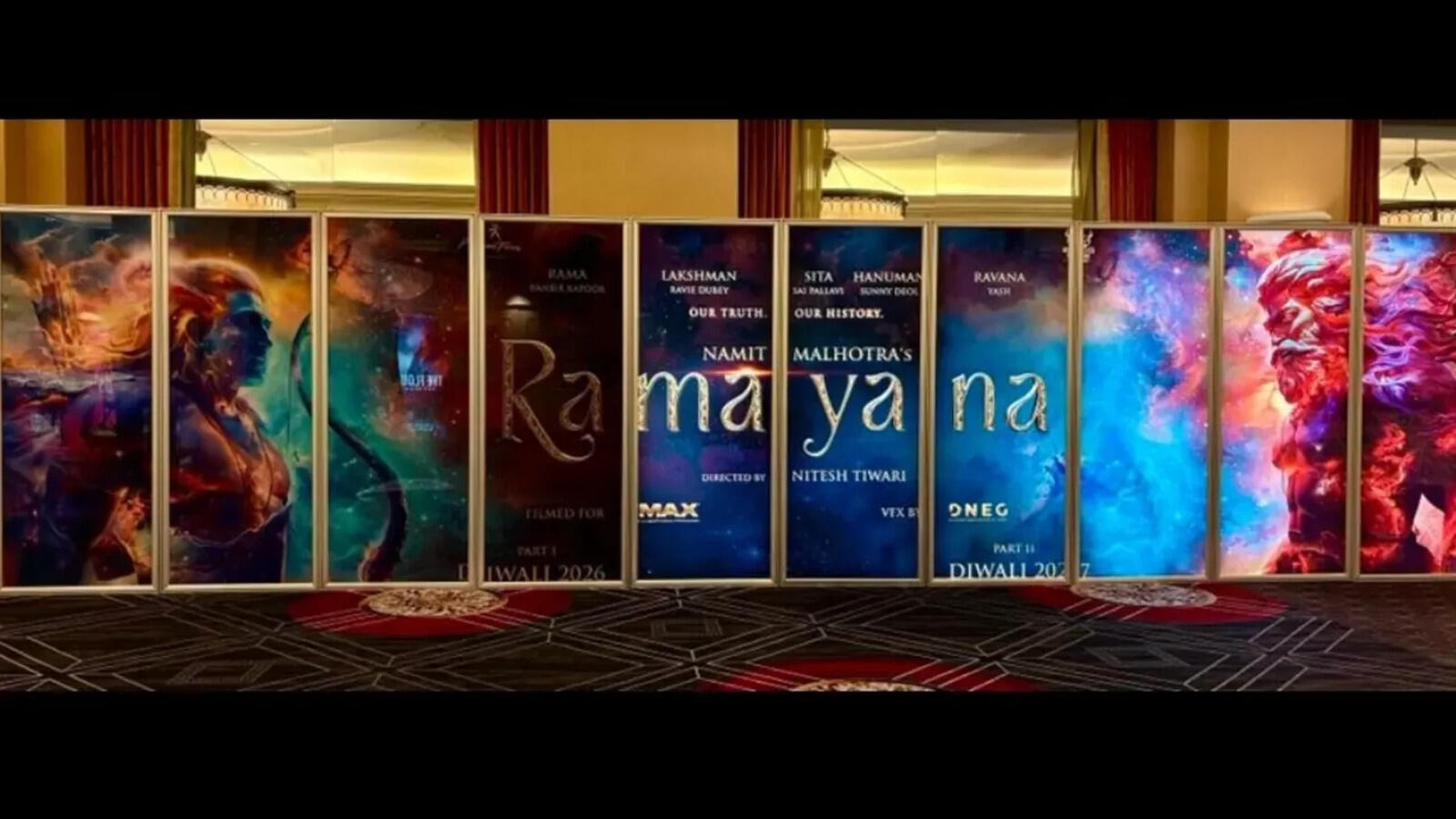Multi-panel Ramayana promotional display with Ranbir Kapoor as Rama and Yash as Ravana flanking the gold title and Diwali 2026 and 2027 release lines.