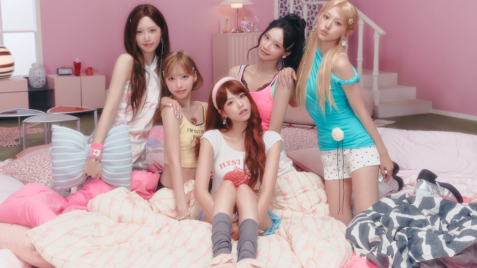 RESCENE members Woni, Liv, Minami, May, and Zena together in the pink bedroom set for their 2026 Pretty Girl campaign.