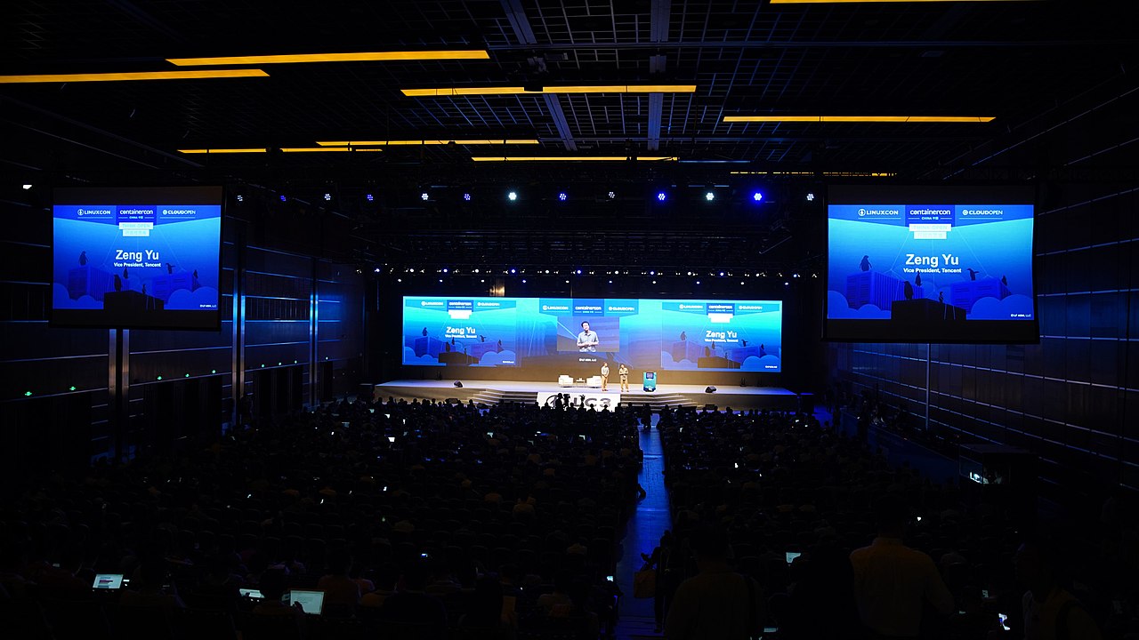 Context image: stage spotlight and microphone.