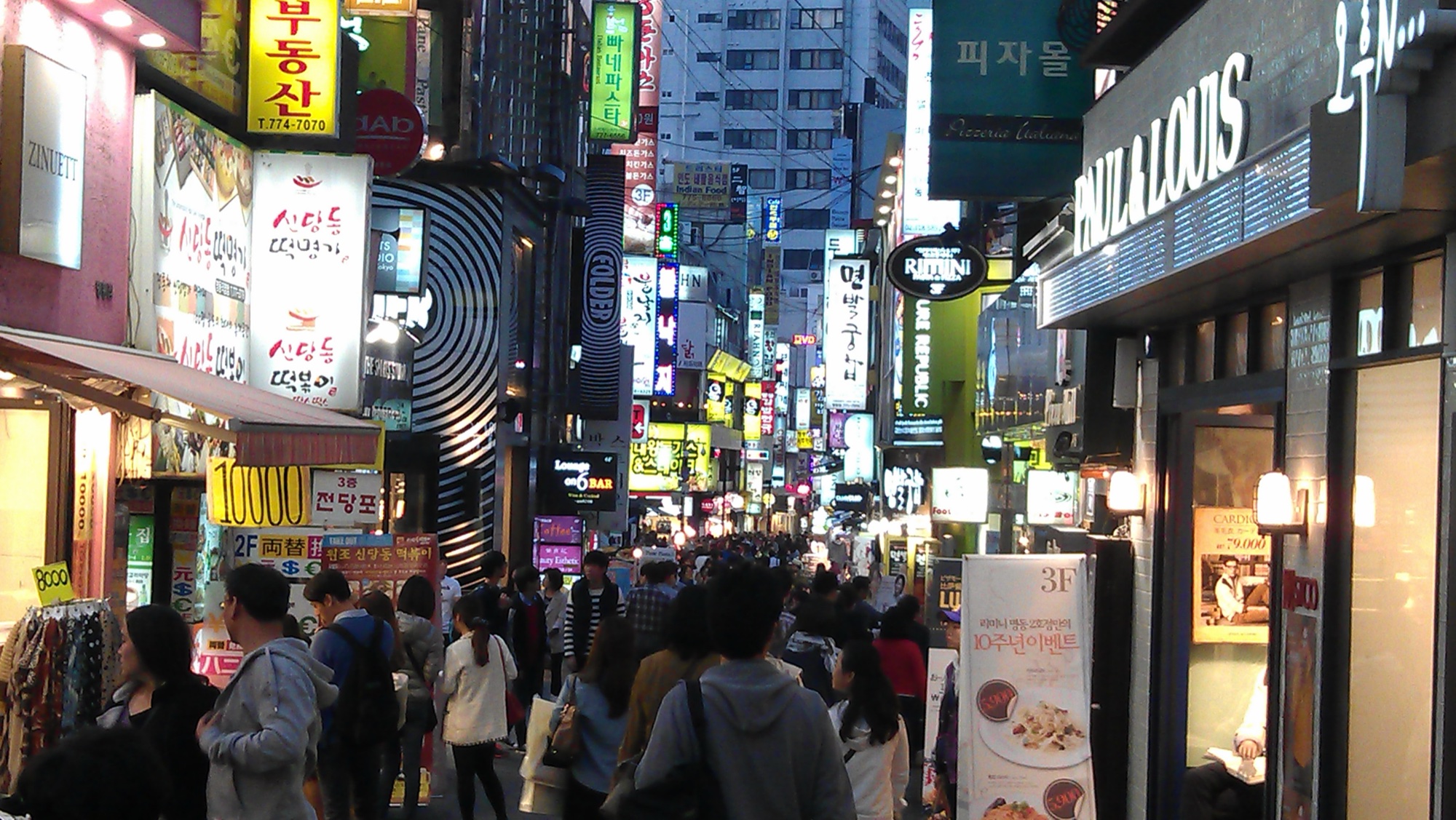 Myeongdong at night in Seoul, the kind of culture pulse Today's Radar tracks daily.